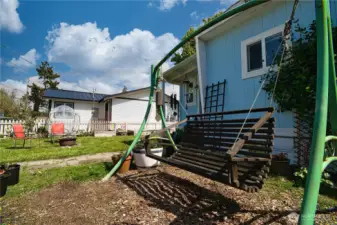 Front of home with lounge swing!