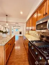 New 5 burner LG gas range oven with air fryer. New Paint, new under cabinet lighting, new pendant lighting, new cabinet knobs. Kitchen is huge! with large Island.