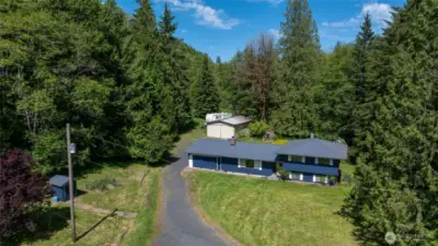Beautiful home with fresh paint, newer metal roof surrounded by trees with a stream in the backyard!!!