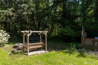 Swing next to your fire-pit next to the stream that flows into the S Fork of the Newakum river