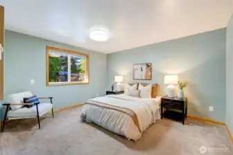 The main-level primary suite has a walk-in closet and full bath