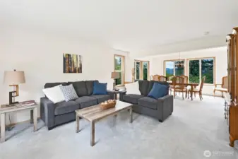 Formal living room and dining room has lots of natural light plus a bay window