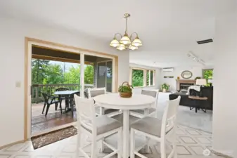 Informal dining area has slider to the large deck overlooking the backyard