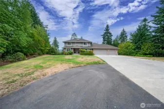 Long driveway and room for RV parking access to 3-car garage