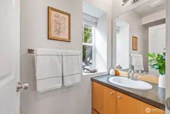 A convenient half bathroom sits just off of your living room.