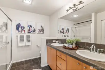 Your en suite master bathroom offers dual sinks, an over-sized shower and incredible storage - more of which is out of frame!