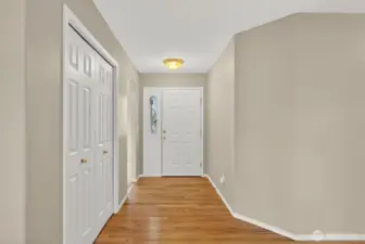 Entry with large entry closet and hardwood floors