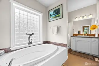 Plenty of vanity space and a separate shower - this bathroom will have you lingering in your self-care!