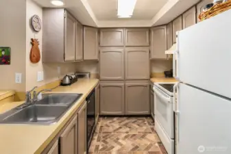 Kitchen has lots of storage space.