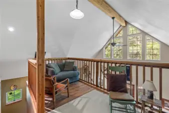 Loft area looking out spacious windows
