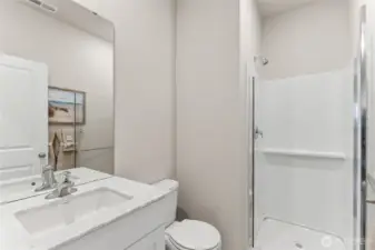 The Ballard offers a guest room and 3/4 bath on the main level.