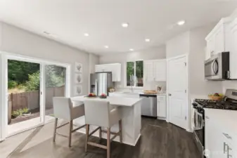 Stainless steel appliances with electric range included. Refrigerator in a builder upgrade. Pictures are for representation only; colors and options will vary.