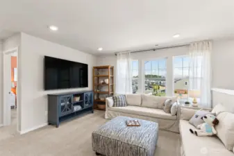 The Ballard has a great open loft area on the upper level. Great space to gather and play games or watch movies! Pictures are for representation only as colors and options will vary.