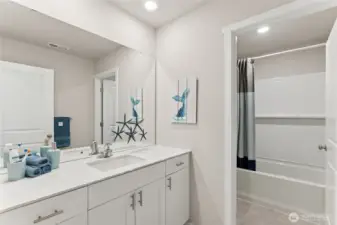 Convenient secondary bathroom with toilet and bathtub private from mirror and sink space. Pictures are for representation only as colors and options will vary. Upper hall bath.