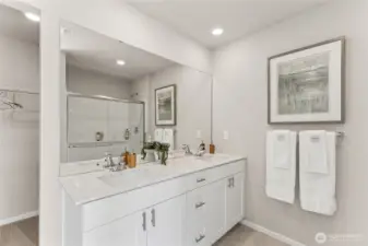 Double vanity with undermount sinks, quartz countertops and luxury vinyl flooring is all included. Pictures are for representation only as colors and options will vary.