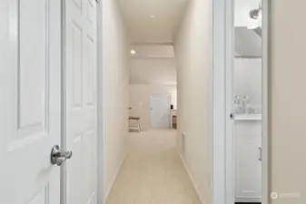 Hallway into the studio apartment. Closet on the left, full, 5-piece bathroom on the right
