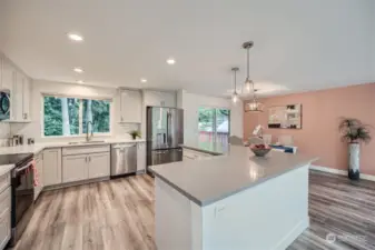 Stunning Open Concept Kitchen Boasting Updated Cabinets, Quartz Countertops and Stainless Steel Appliances
