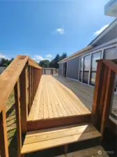 Brand new deck the length of the home, plus a private door off the primary!