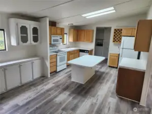 Huge open kitchen with so much cabinet space!