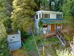 The existing house is two stories with a basement. And the single car garage is attached to the house at the basement level.