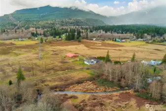 Beautiful mountain views looking southeast, with Little Quilcene River winding through the bottom of the image