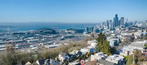 Incredible views from the rooftop deck of downtown Seattle, the Stadiums, Elliott Bay and the snow capped mountains!