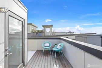 Multiple spaces on this rooftop deck for relaxing and a BBQ while admiring the views.