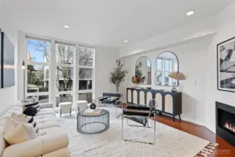 Lots of space in this large living room with glass rock fireplace.