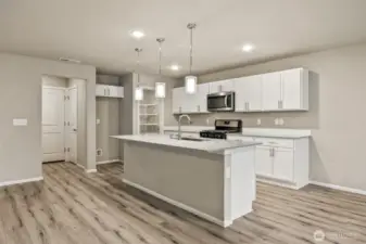 Open concept living/dining/kitchen-Interior Pictures: Disclaimer- Photos are of another Finley floor plan from a previous community, photos are for illustrative purposes only. Finishes, flooring, upgrades, or other features may vary.