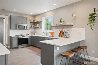 The expansive kitchen has been completely updated - cabinets, countertop, & appliances, too!