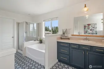 A walk-in shower and a spacious, walk-in closet make this an ideal en-suite.
