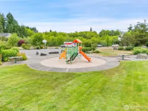 Park amenities include picnic tables, a HUGE grassy area, and play equipment.