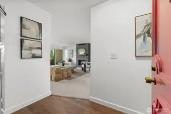 Clean lines and natural light greet you as you enter your new home. The living room and kitchen are to the left and the private wing en suite, second bedroom and full bath are to the right.