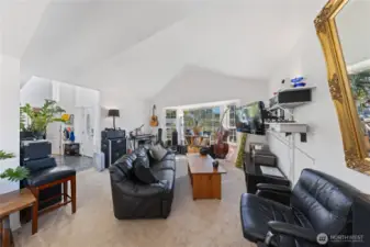 Enter the foyer with the office on the immediate right as you enter the home.  Light, bright vaulted ceilings and large picture windows for natural light.