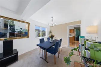 Here's another angel of the formal dining room and kitchen.  You can see the office off the foyer in the mirror.  That white door opens into the office with a window and closet.