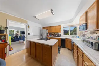 The kitchen is very large and is conveniently located next to the formal dining room.  Items have been removed to allow for a better feel for the space available. Lots of counter space and storage.