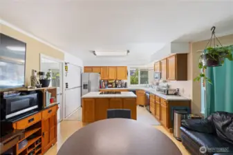 The kitchen has eating space, seating areas, fireplace and makes a wonderful, warm gathering space.