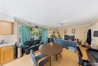 This photo shows the large windows and slider access to the large entertaining, newly painted decking where you can BBQ and relax with friends.