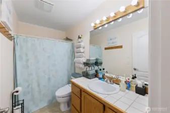 There is a full bathroom on the upper level between the bedrooms.