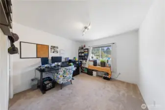 This bedroom/office is located at the right as you enter the upper level.  There's a closet on the left and the full bathroom is right across the hallway.