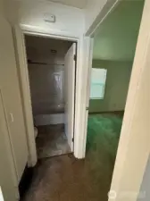 Full bath on the left  and bedroom on the right