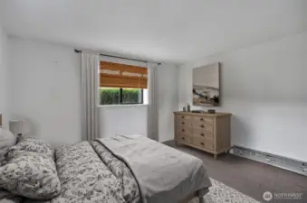 Lower-level bedroom. This photo has been virtually staged.