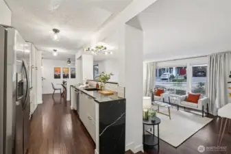 View of Kitchen with sunken Living Room with oversized windows