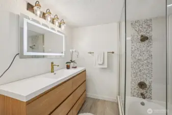 Full bathroom complete with Tub and Tiled Shower