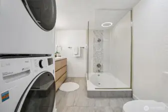 Stacking Front Load Washer & Dyer located in the Bathroom