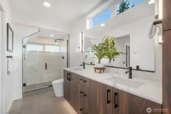 Spacious (!) primary bathroom offers double sink vanity with quartz counter tops and oodles of cabinet/drawer space!   Photos are of model home of same floorplan. Color schemes will vary.