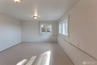 2nd room in the daylight basement could be a wine room or storage area or more gym!