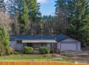 Freshly updated home on nearly an acre featuring a brand NEW roof, new exterior paint, and a peaceful country setting surrounded by mature trees.