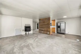 Large open living area highlights the home’s flowing layout with easy access to the kitchen and dining spaces.