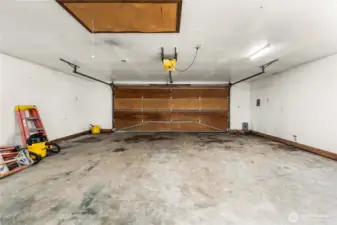 Garage interior offers ample room for vehicles, storage, hobbies, or workshop use.